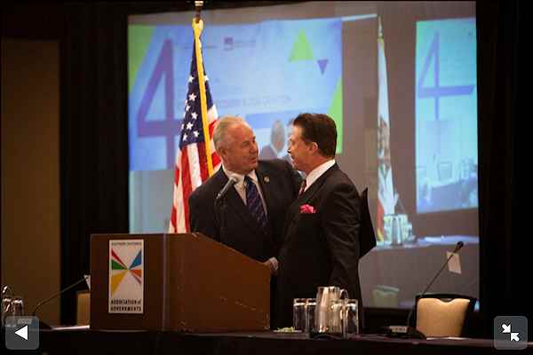 Frank Mottek welcomes LA City Councilman Tom Labonge to SCAG Economic Summit, 2013